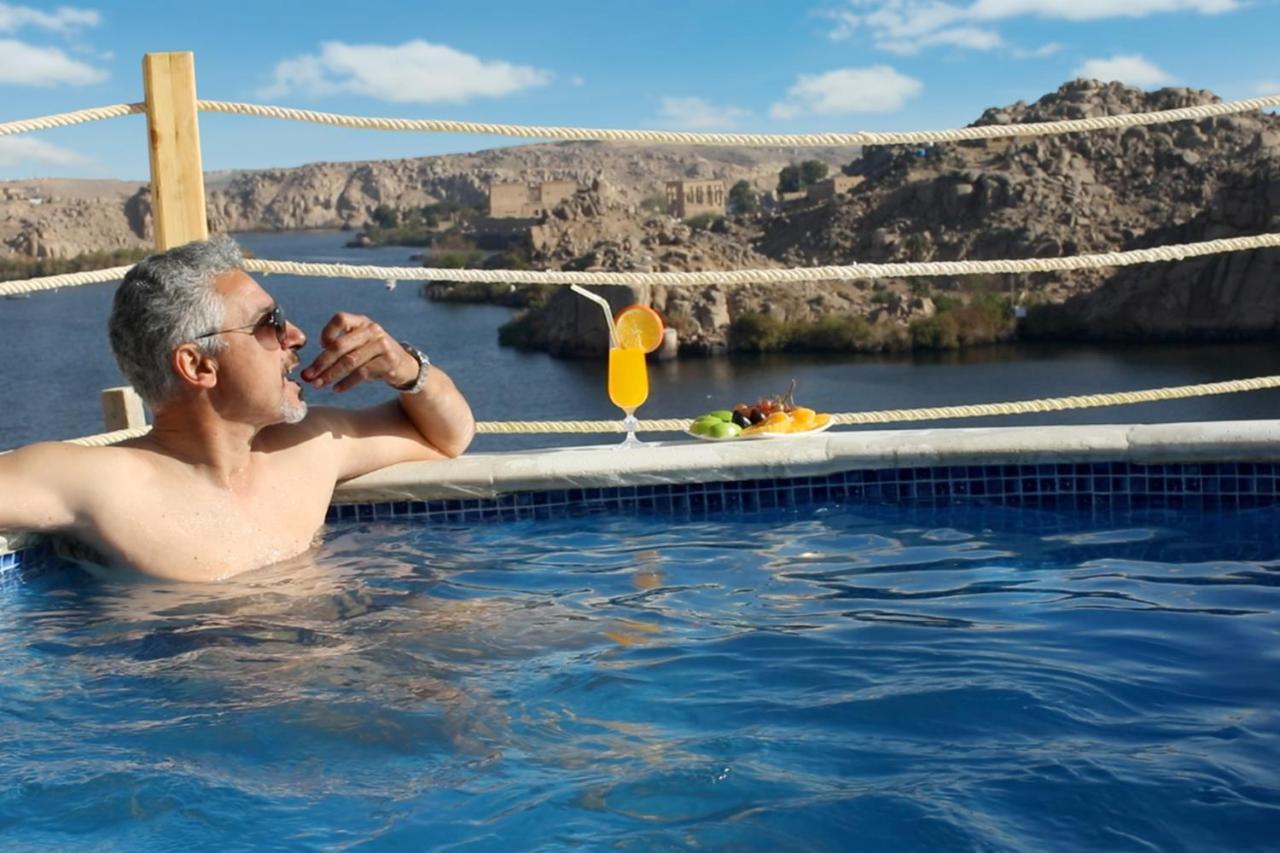 Benben By Dhara Hotels - Adults Only Aswan Exterior photo A man relaxing in a swimming pool